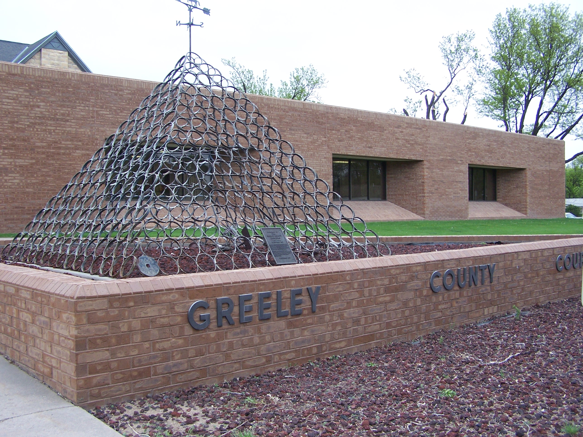 Greeley County courthouse sculpture and sign